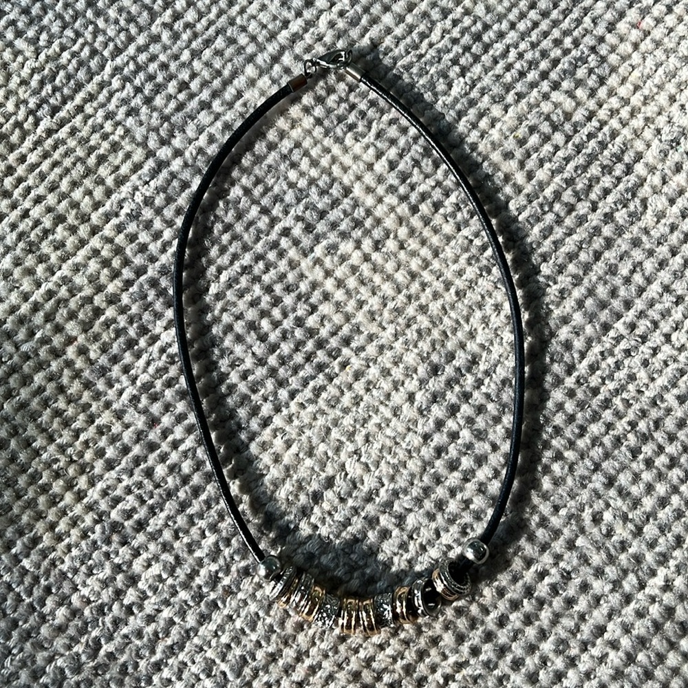 Charm necklace with black leather cord